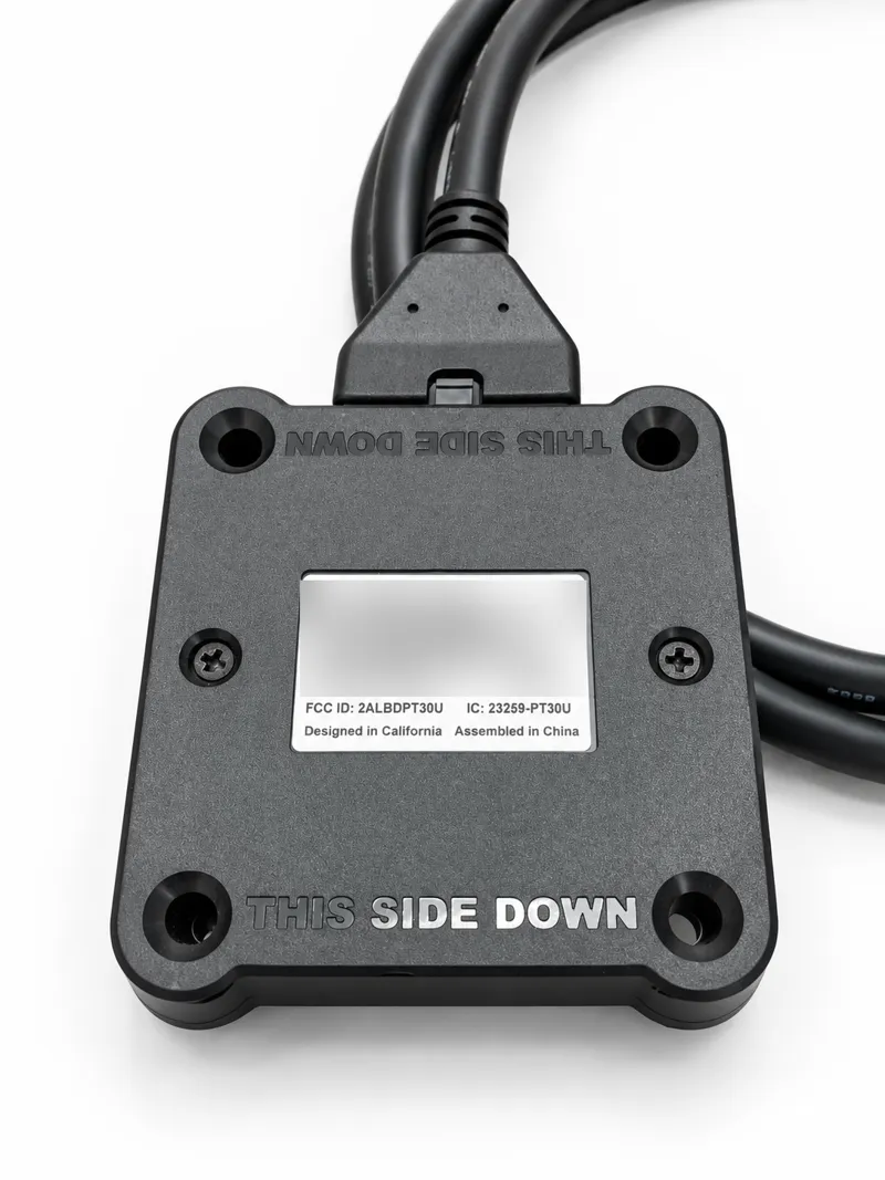 Underside of the PT-30 device with its label area and mounting screws